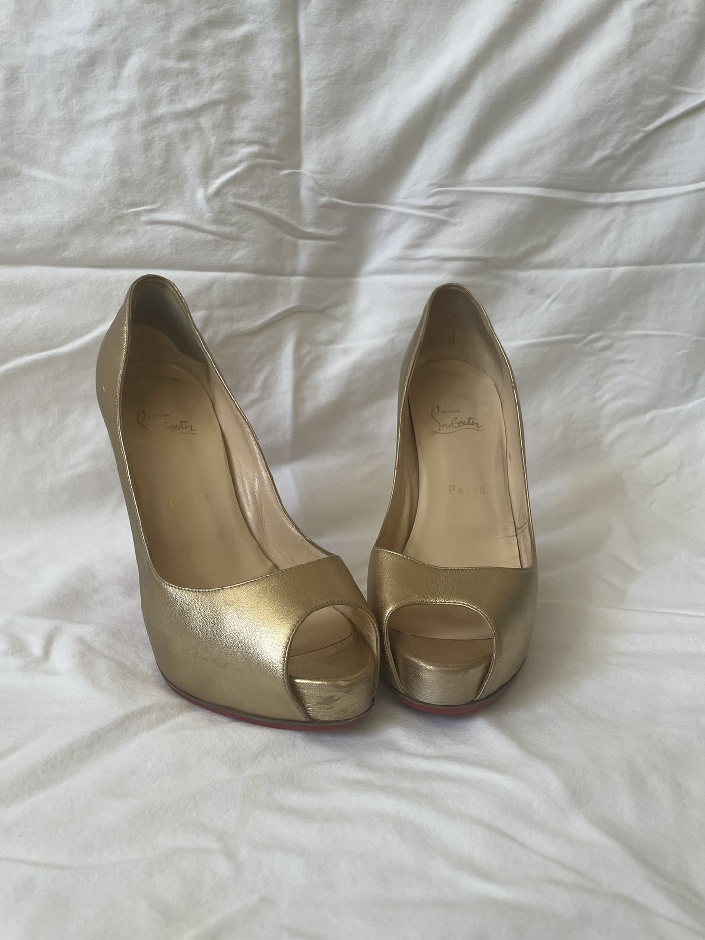 Christian Louboutin Gold Pumps