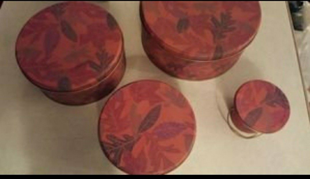 This great set of 4 matching tins with lids 8" 7" 6" 3"