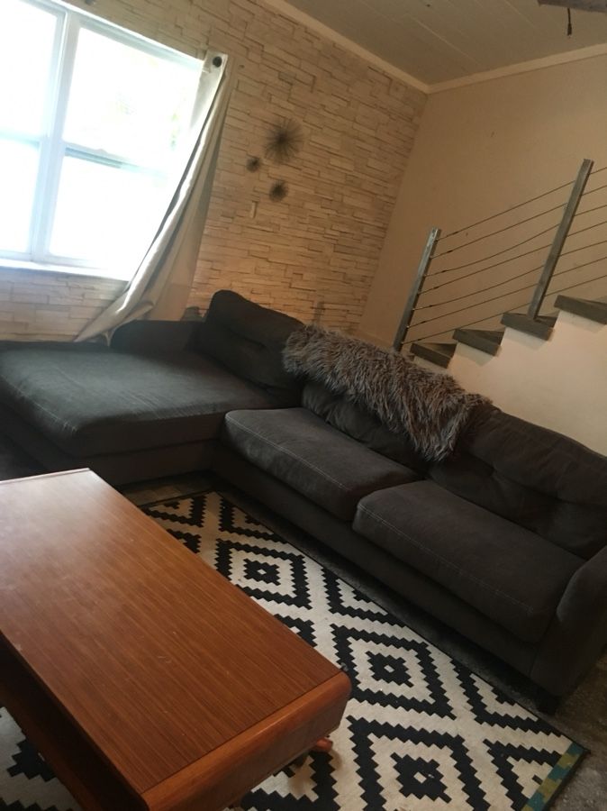 Slate grey cloth sectional couch with chaise