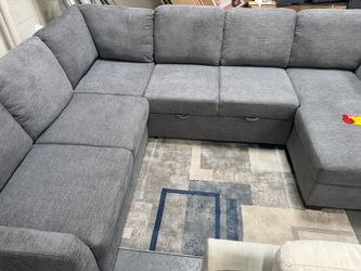 Grey Pullout bed sectional with storage