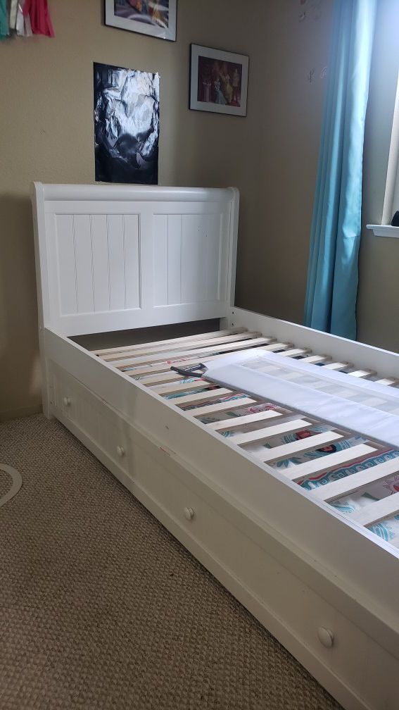 White twin bed frame with trundle