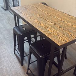 Brown Table With 4 Black Chairs