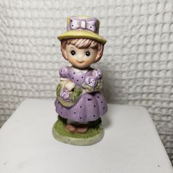 Vintage 1980 CMA girl in purple figurine. 