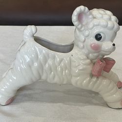 Vintage ceramic lamb planter with pink accents and a textured woolly design.