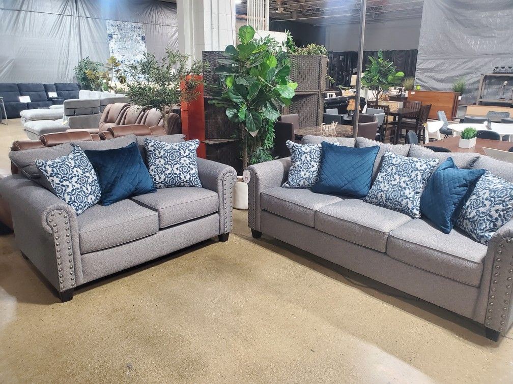 Beautiful 2 pc Gray sofa love seat with nailheads (New)