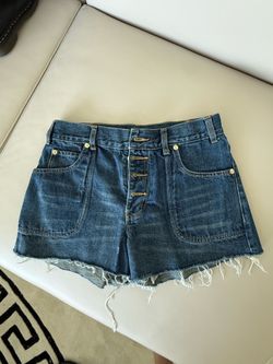 Dark wash denim shorts with button fly and frayed hem. Size: 27" #denim #summer