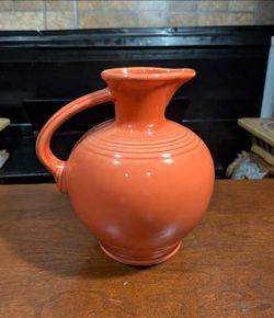 8" x 7.5" Vintage Homer Laughlin Fiestaware Handled Carafe in the retired Persimmon orange glaze color.
