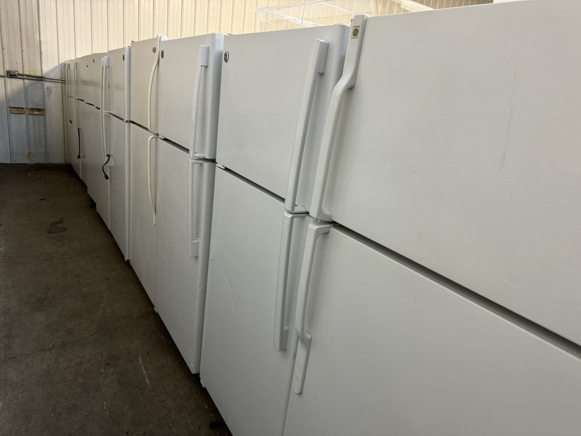 Several Clean White Refrigerators