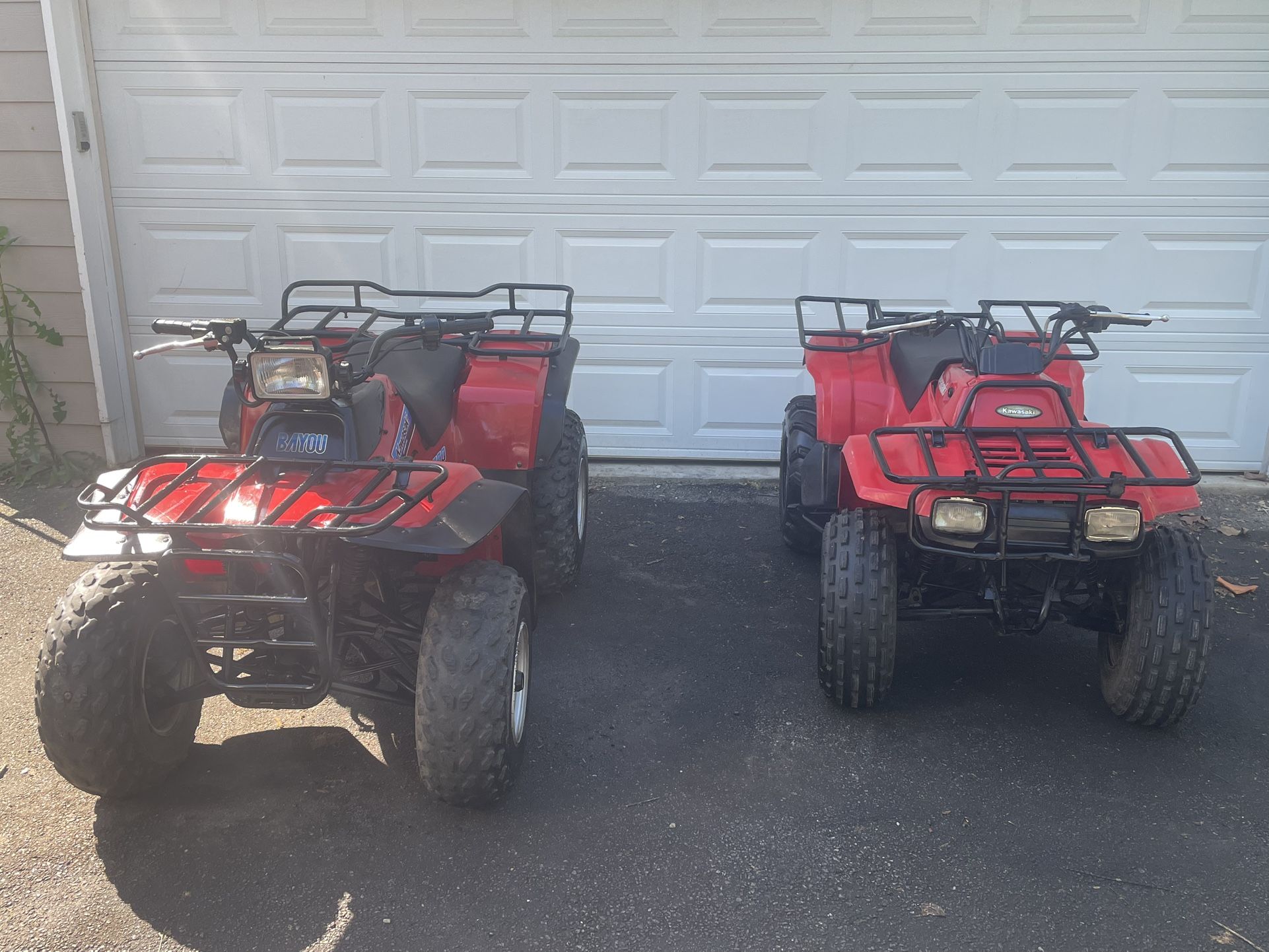 Two Kawaski Bayou ATVs - Bayou 200 and a Bayou 300