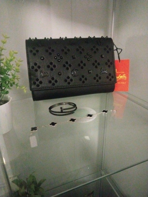 Christian Louboutin Purse , ( Latest) Cartier Nail Bracelet, and  Van Cleef Black  and Silver Bracelet 
