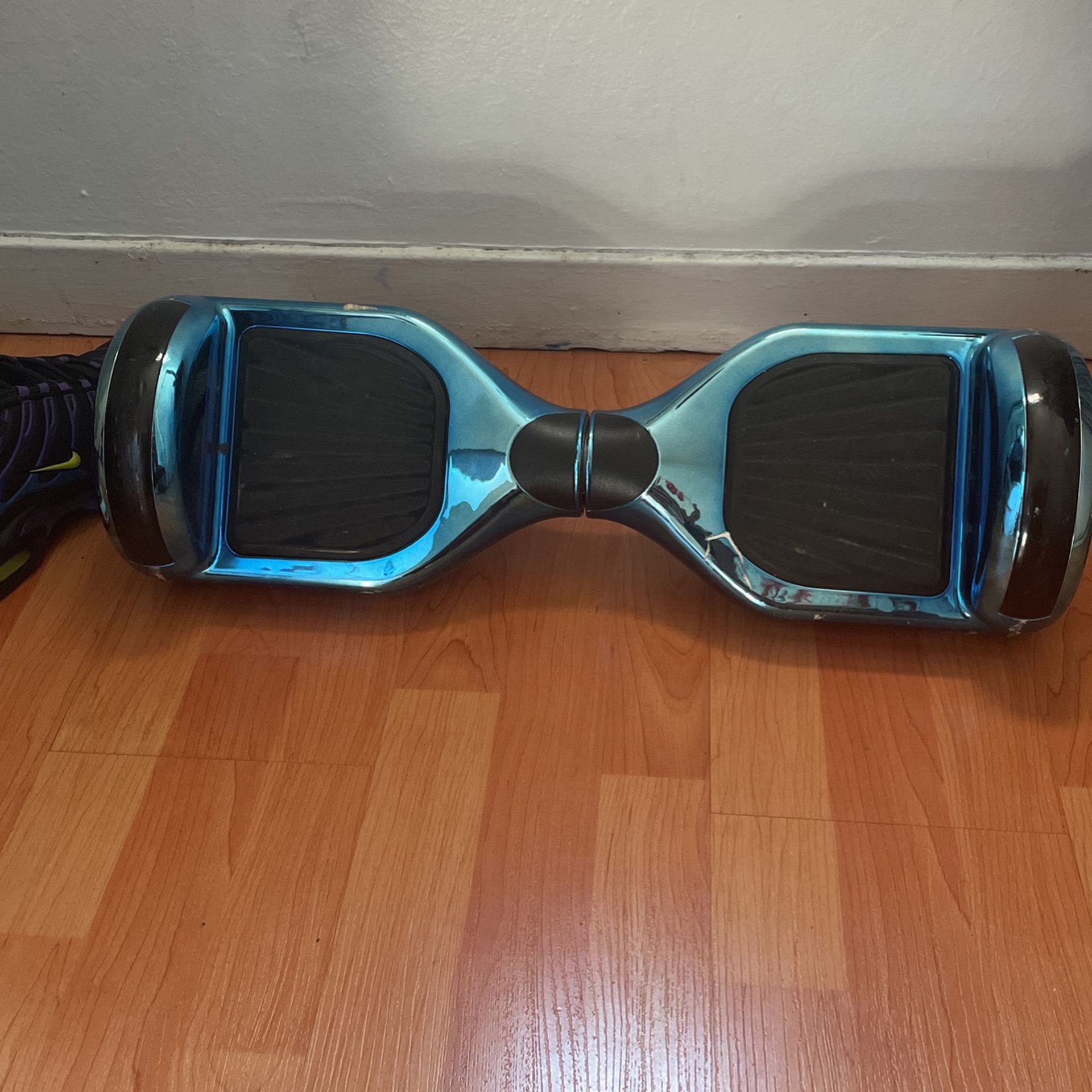 metallic blue hoverboard with charging cable 