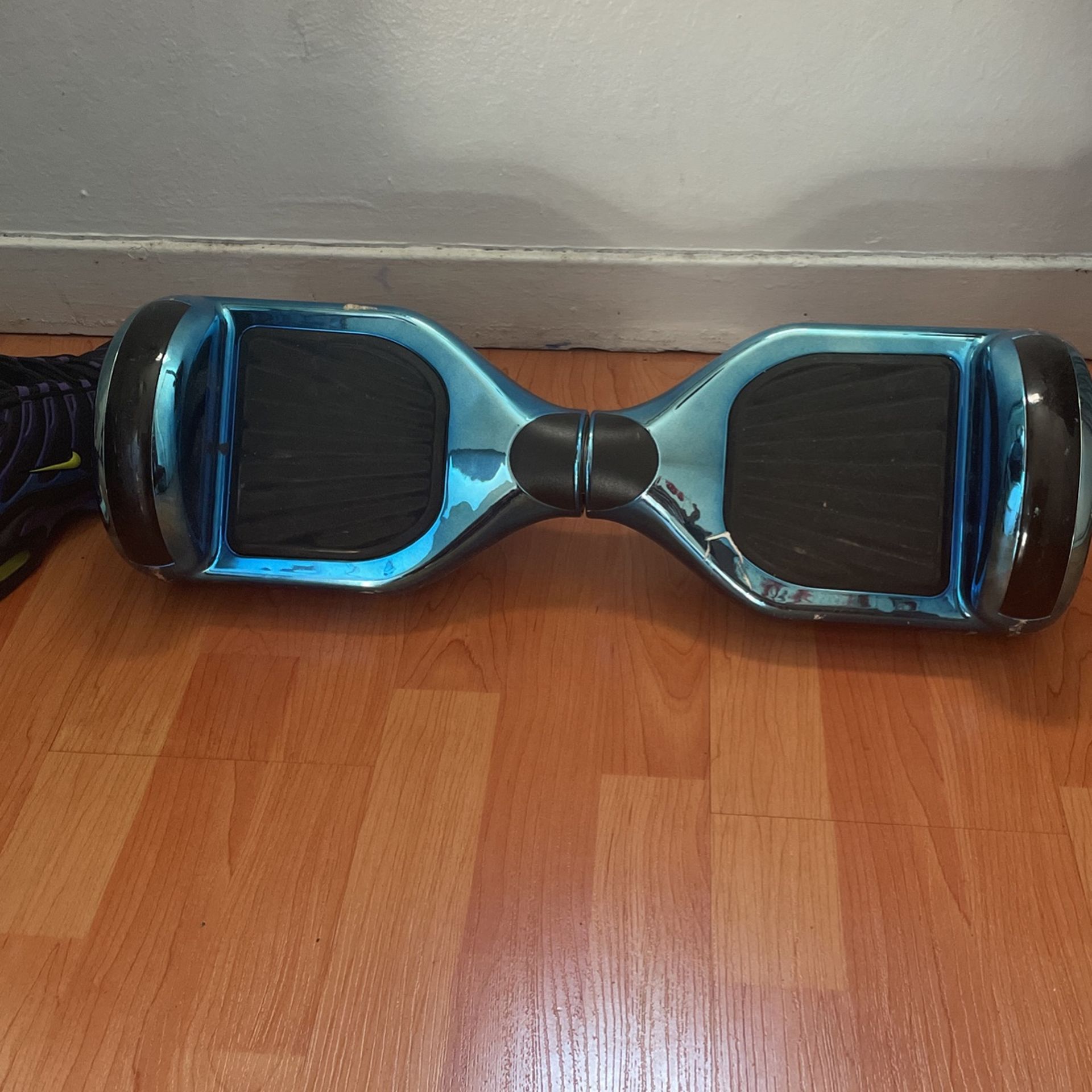 metallic blue hoverboard with charging cable
