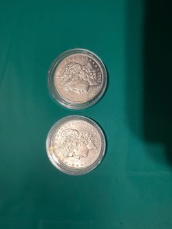 2 beautiful Morgan silver dollars
