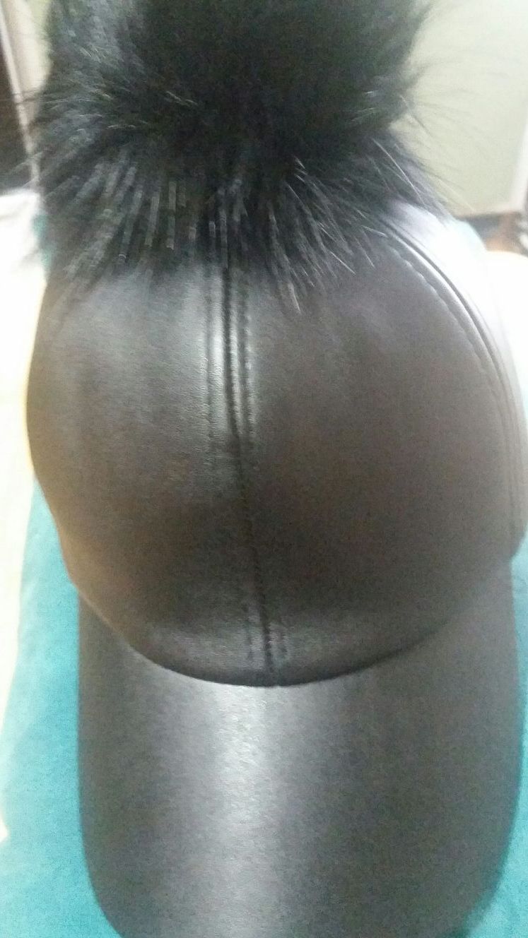 Leather like cap with Raccoon Fur Topper