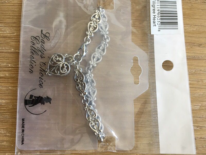 Bracelet with filigree heart charm silver color