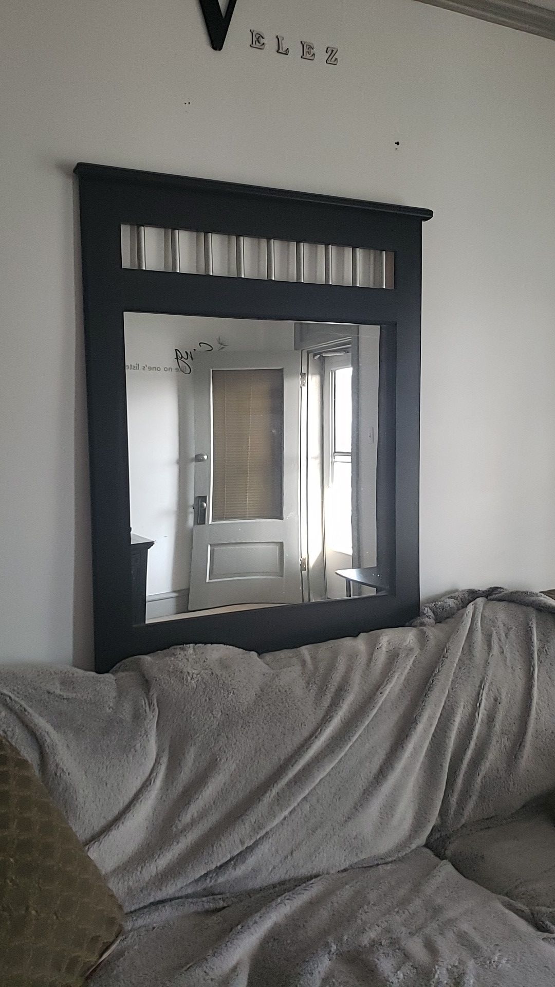 Wall mirror with hooks