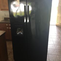 Appliances side -by-side fridge with icemaker flat top stove microwave and dishwasher