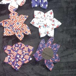 Colorful fabric flowers for ponytails in various patterns.