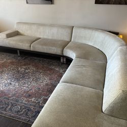 Modern low back sofa with built in end table