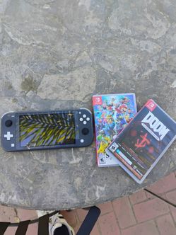 Grey Nintendo Switch Lite + Super Smash Bros. Ultimate+ DOOM:Slayers Collection