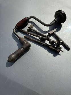 Antique hand drill with bits