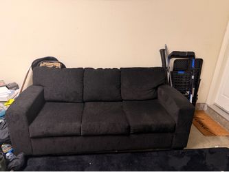 Black couch from living spaces