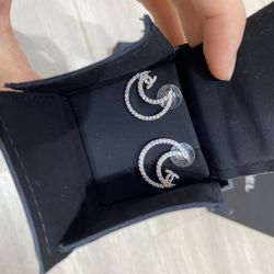 Demure silver crescent earrings
