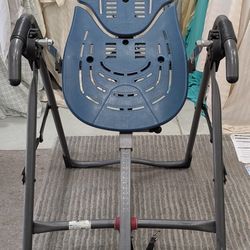 Teeter Inversion Table, Specifically A Model From The Hang Up Series.