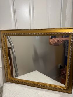 Gold trimmed mirror