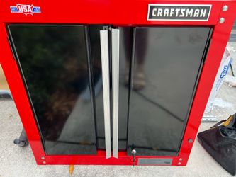 Two craftsman wall mounted garage cabinet