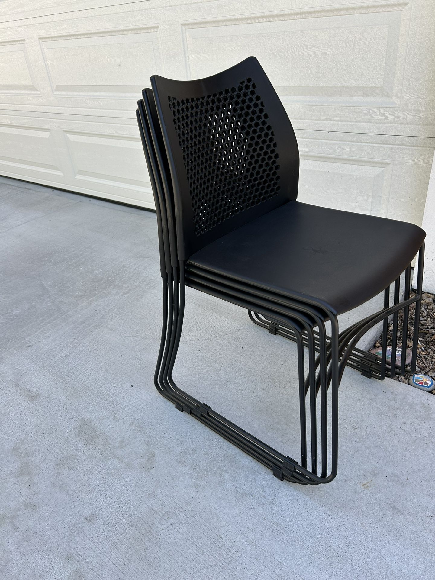 Stackable plastic chairs