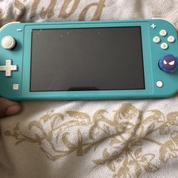 Nintendo Switch Lite W/ Three games