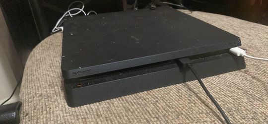 Sony PlayStation 4 Slim with Two Controllers