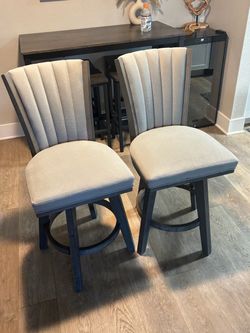 Two barstool swivel chairs