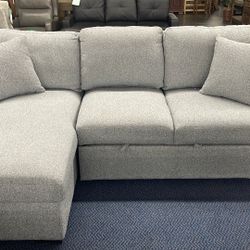 Sectional With Pull Out Bed And Storage Chaise 