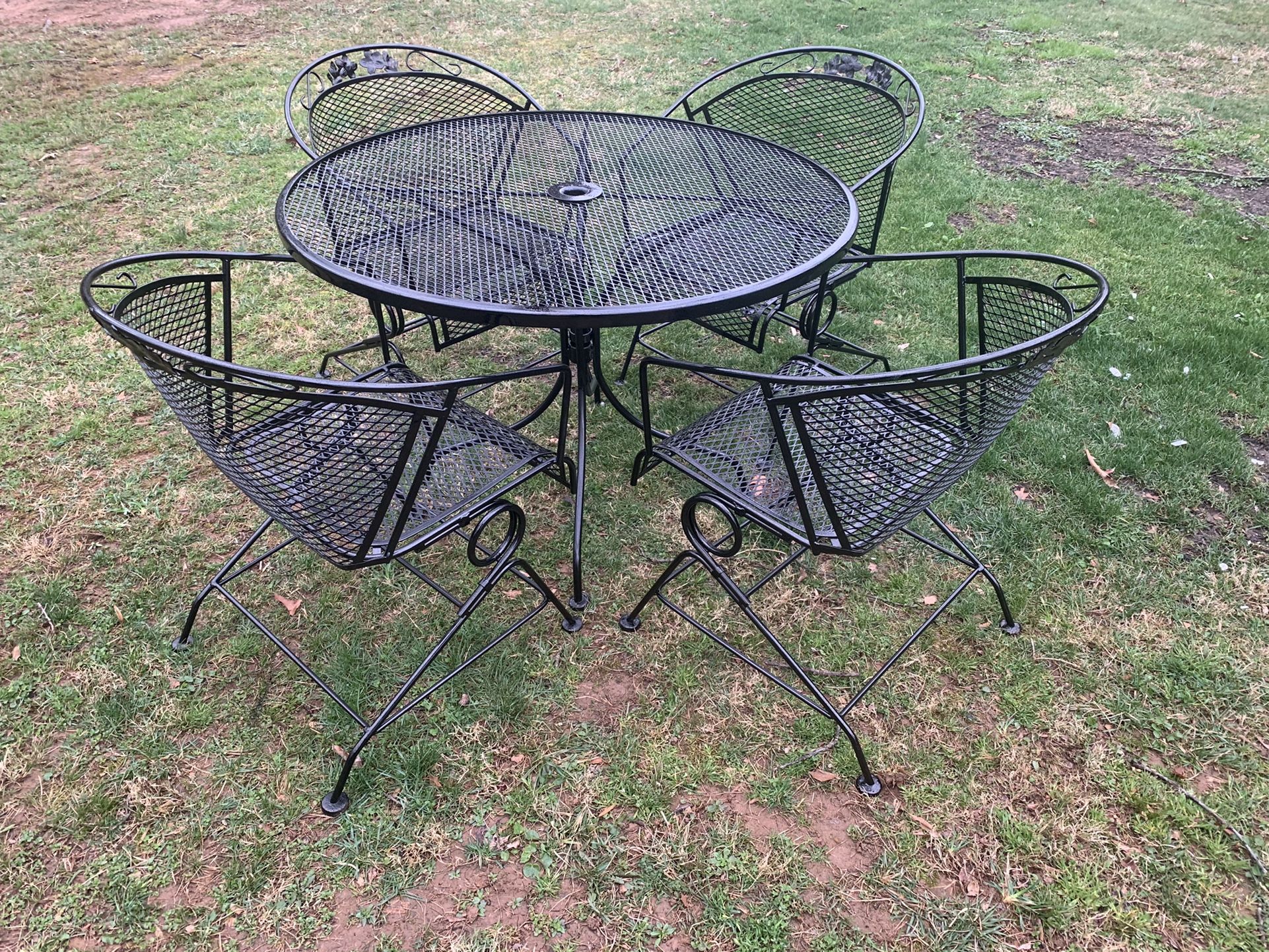 Gorgeous wrought iron patio set large table, 4 barrel chairs & stand