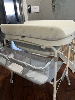 Brand New portable baby tub/changing station w/ storage