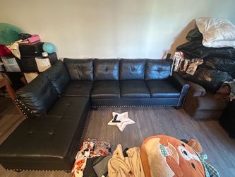 Block and silver l shaped couch