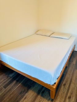 Queen size bed with solid wood bed frame and memory foam mattress. Two pillows and two extra warm comforters are included