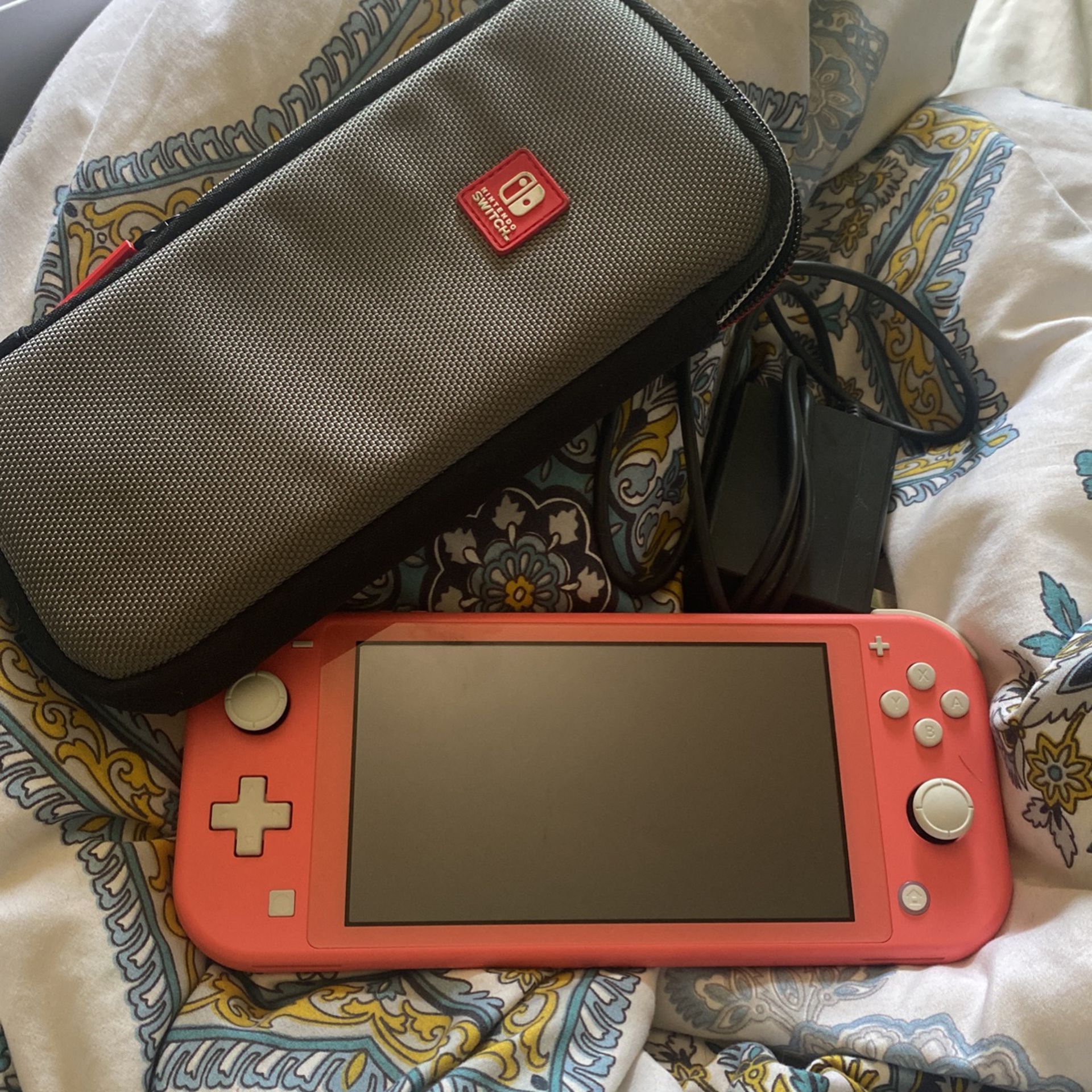 Nintendo Switch Lite. (Case and charger included)