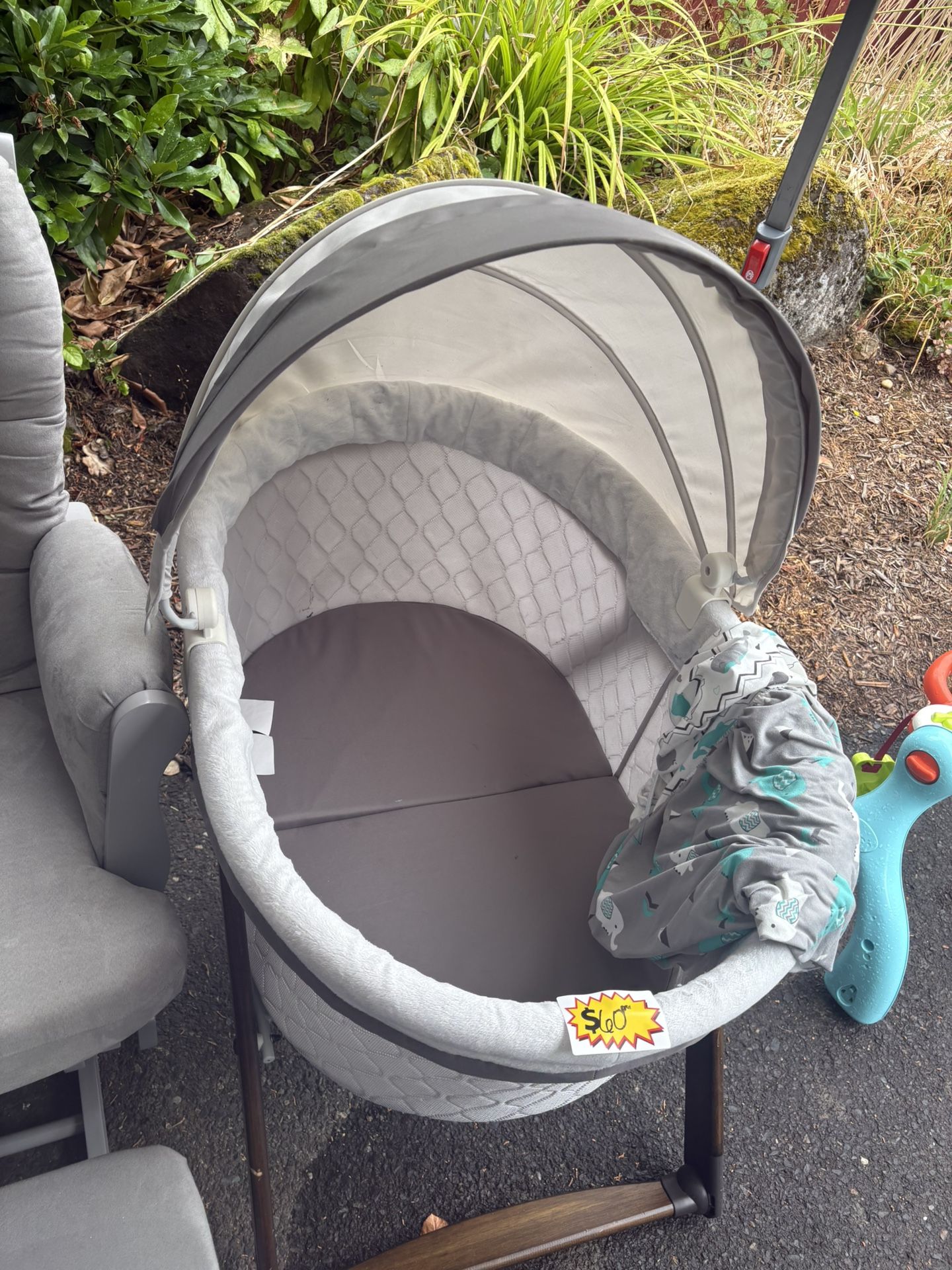 Grey Rocking Chair And Folding Bassinet
