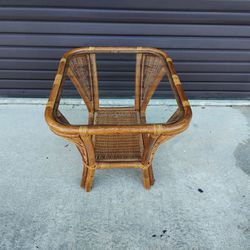 Vintage 1970'S  Vari Wood Brand  Rattan Table with Wicker Corner Treatment And Lower Shelf  - Glass Top- Rounded Corners  End Table. 