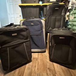 Suitcases - Set Of 4 - All On Rollers