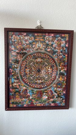 Framed Tibetan Buddhist Mandala Thangka painting with intricate figures.