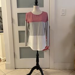 Yun Jey brand casual long-sleeved blouse with round neck and three color block design.