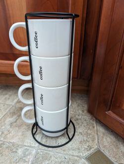 Four Coffee Cups In The Wired Cup Holder