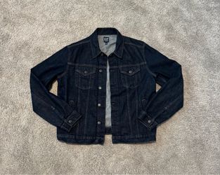 Dark wash Gap Denim "Icon" trucker jacket featuring a classic structured collar and front button closure