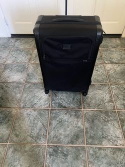 Tumi 26-28 size checked suitcase