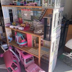 Barbie House plane helicopter cars accessories. Box of Barbie’s and Barbie clothes.