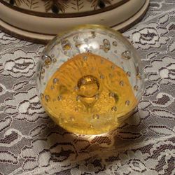 Clear Glass Ball Paperweight With Yellow Inside